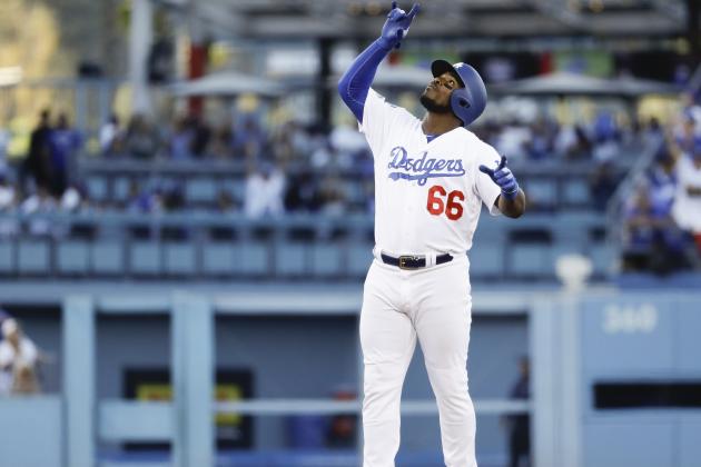 Los Angeles Dodgers' Yasiel Puig reacts after hitting a double during the second inning of Game 3 of the National League Championship Series baseball game against the Milwaukee Brewers Monday, Oct. 15, 2018, in Los Angeles. (AP Photo/Matt Slocum)