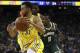 Golden State Warriors' Stephen Curry drives the ball past Milwaukee Bucks' Eric Bledsoe (6) during the first half of an NBA basketball game Thursday, Nov. 8, 2018, in Oakland, Calif. (AP Photo/Ben Margot)