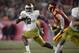 Notre Dame running back Dexter Williams, left, carries the ball as Southern California cornerback Chase Williams defends during the second half of an NCAA college football game Saturday, Nov. 24, 2018, in Los Angeles. Notre Dame won 24-17. (AP Photo/Mark J. Terrill)