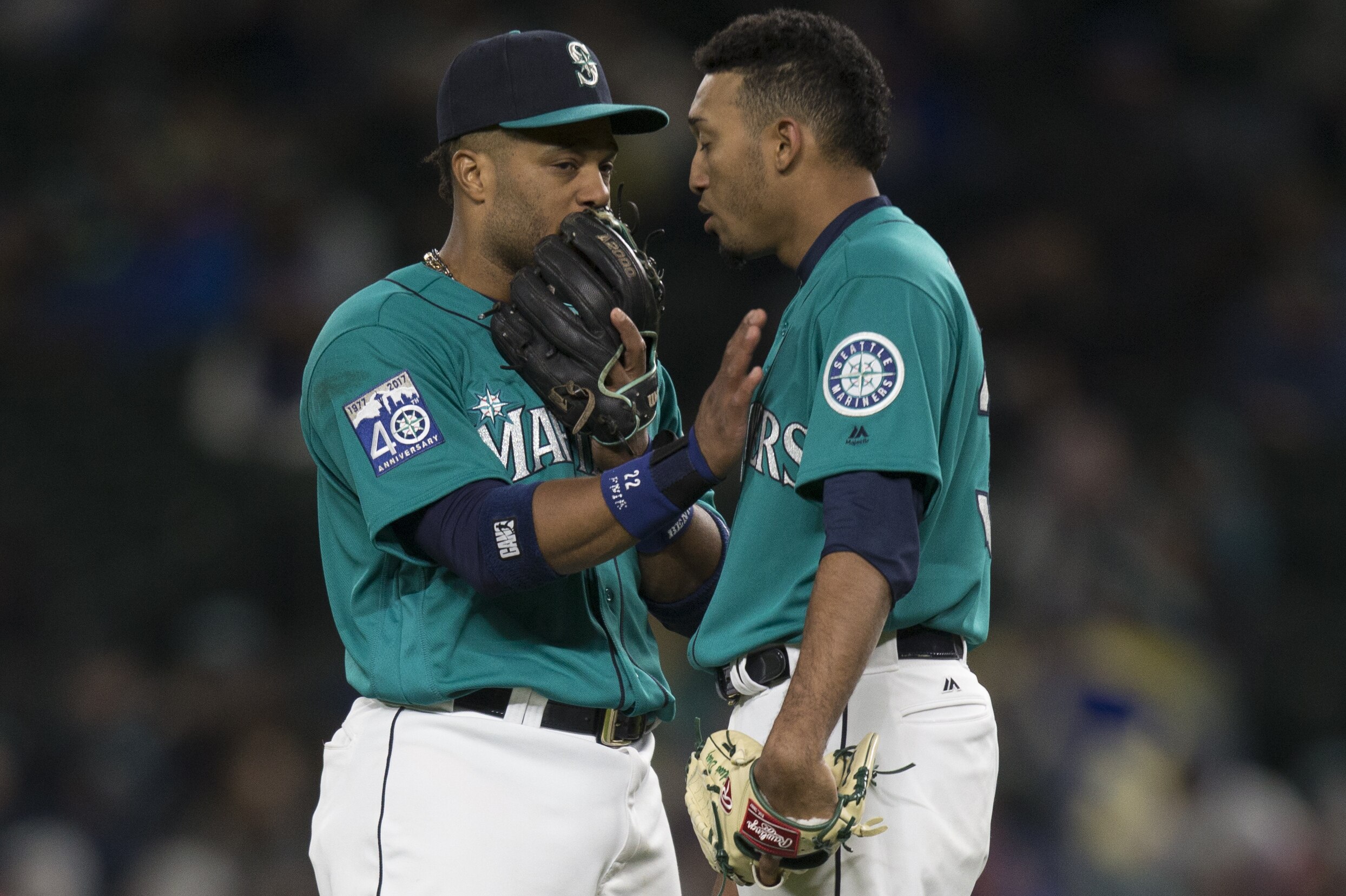 SEATTLE, WA - MAY 5: Relief pitcher Edwin Diaz #39, right, of the Seattle Mariners talks with second baseman Robinson Cano #22 of the Seattle Mariners before taking the mound during a game against the Texas Rangers at Safeco Field on May 5, 2017 in Seattle, Washington. The Rangers won the game 3-1 in 13 innings. (Photo by Stephen Brashear/Getty Images)
