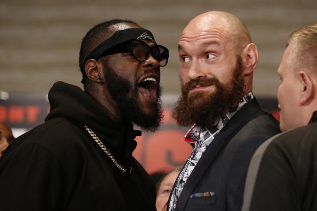 Boxers Deontay Wilder, left, and Tyson Fury exchange words as they face each other at a news conference in Los Angeles, Wednesday, Nov. 28, 2018. The pair are slated to fight Saturday night for Wilder's WBC heavyweight title. (AP Photo/Damian Dovarganes)