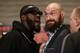 Boxers Deontay Wilder, left, and Tyson Fury exchange words as they face each other at a news conference in Los Angeles, Wednesday, Nov. 28, 2018. The pair are slated to fight Saturday night for Wilder's WBC heavyweight title. (AP Photo/Damian Dovarganes)