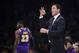 Los Angeles Lakers head coach Luke Walton, right, gestures as forward LeBron James stands in the background during the first half of an NBA basketball game against the Minnesota Timberwolves Wednesday, Nov. 7, 2018, in Los Angeles. (AP Photo/Mark J. Terrill)