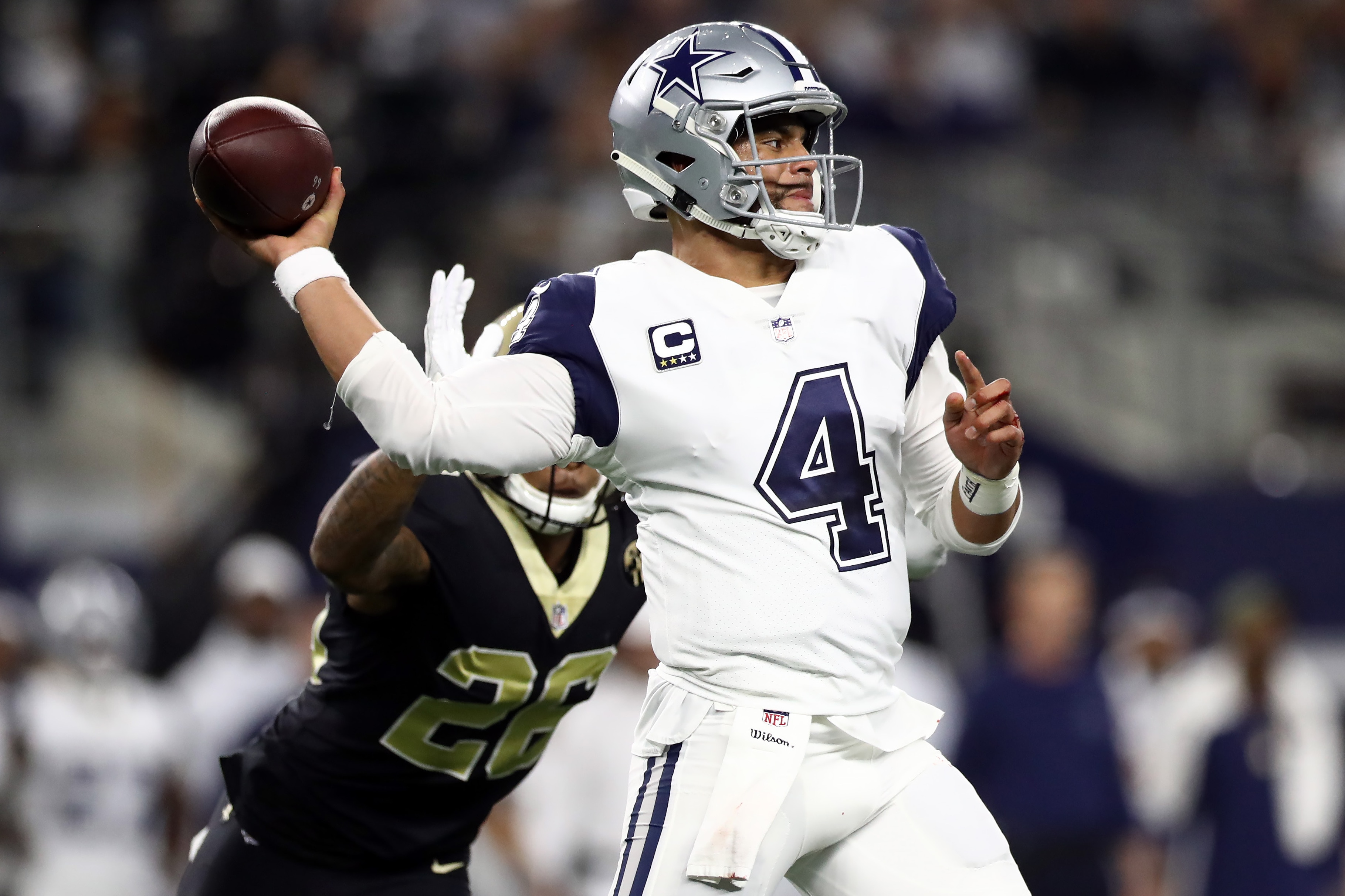 ARLINGTON, TEXAS - NOVEMBER 29:  Dak Prescott #4 of the Dallas Cowboys throws against the New Orleans Saints in the first quarter at AT&T Stadium on November 29, 2018 in Arlington, Texas. (Photo by Ronald Martinez/Getty Images)