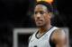 San Antonio Spurs' DeMar DeRozan walks upcourt during the second half of an NBA basketball game against the New Orleans Pelicans, Saturday, Nov. 3, 2018, in San Antonio. San Antonio won 109-95. (AP Photo/Darren Abate)