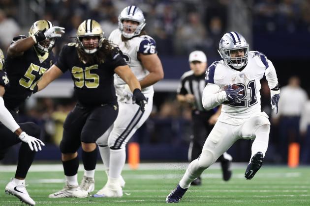 ARLINGTON, TEXAS - NOVEMBER 29:  Ezekiel Elliott #21 of the Dallas Cowboys runs for a first down in the fourth quarter against the New Orleans Saints at AT&T Stadium on November 29, 2018 in Arlington, Texas. (Photo by Ronald Martinez/Getty Images)