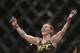 FILE - In this Sept. 25, 2016, file photo, Brazil's Cris “Cyborg” Justino celebrates after defeating Sweden's Lina Lansberg during a UFC Fight Night mixed martial arts bout in Brasilia, Brazil. Justino agreed to make a title defense against Yana Kunitskaya, of Russia, on short notice in the headlining bout at UFC 222 because she believes champions should be willing to fight anywhere at any time. (AP Photo/Eraldo Peres, File)