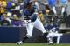 MILWAUKEE, WI - OCTOBER 05: Jonathan Schoop #5 of the Milwaukee Brewers at bat during Game Two of the National League Divisional Series against the Colorado Rockies at Miller Park on October 5, 2018 in Milwaukee, Wisconsin. The Brewers defeated the Rockies 4-0. (Photo by Stacy Revere/Getty Images)