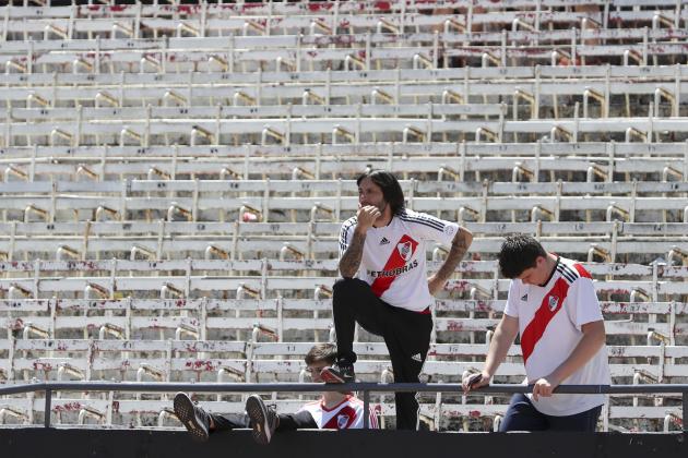 Fans of Argentina's River Plate react to the announcement that the final Copa Libertadores soccer match against Argentina's Boca Juniors was suspended, at Antonio Vespucio Liberti stadium in Buenos Aires, Argentina, Sunday, Nov. 25, 2018. South American soccer body CONMEBOL said on Sunday that the second leg of the final will be rescheduled after Boca’s bus was attacked by River fans on Saturday. (AP Photo/Ricardo Mazalan)