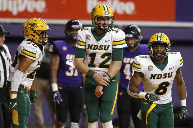 North Dakota State quarterback Easton Stick (12) celebrates with teammates Darrius Shepherd, left, and Bruce Anderson (8) after a 31-yard touchdown run in the second half of an NCAA college football game against Northern Iowa, Saturday, Oct. 6, 2018, in Cedar Falls, Iowa. North Dakota State won 56-31. (AP Photo/Charlie Neibergall)