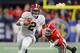 ATLANTA, GA - DECEMBER 01: Jalen Hurts #2 of the Alabama Crimson Tide runs with the ball as Walter Grant #84 of the Georgia Bulldogs pursues him in the fourth quarter during the 2018 SEC Championship Game at Mercedes-Benz Stadium on December 1, 2018 in Atlanta, Georgia. (Photo by Kevin C. Cox/Getty Images)