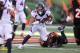 CINCINNATI, OH - DECEMBER 2: Phillip Lindsay #30 of the Denver Broncos slips out of an attempted tackle by Vontaze Burfict #55 of the Cincinnati Bengals during the second quarter at Paul Brown Stadium on December 2, 2018 in Cincinnati, Ohio. (Photo by John Grieshop/Getty Images)