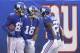 New York Giants wide receiver Russell Shepard, left, celebrates with teammates wide receiver Bennie Fowler (18) and running back Wayne Gallman (22) after catching a touchdown pass from wide receiver Odell Beckham, not pictured, during the second half of an NFL football game against the Chicago Bears, Sunday, Dec. 2, 2018, in East Rutherford, N.J. (AP Photo/Bill Kostroun)