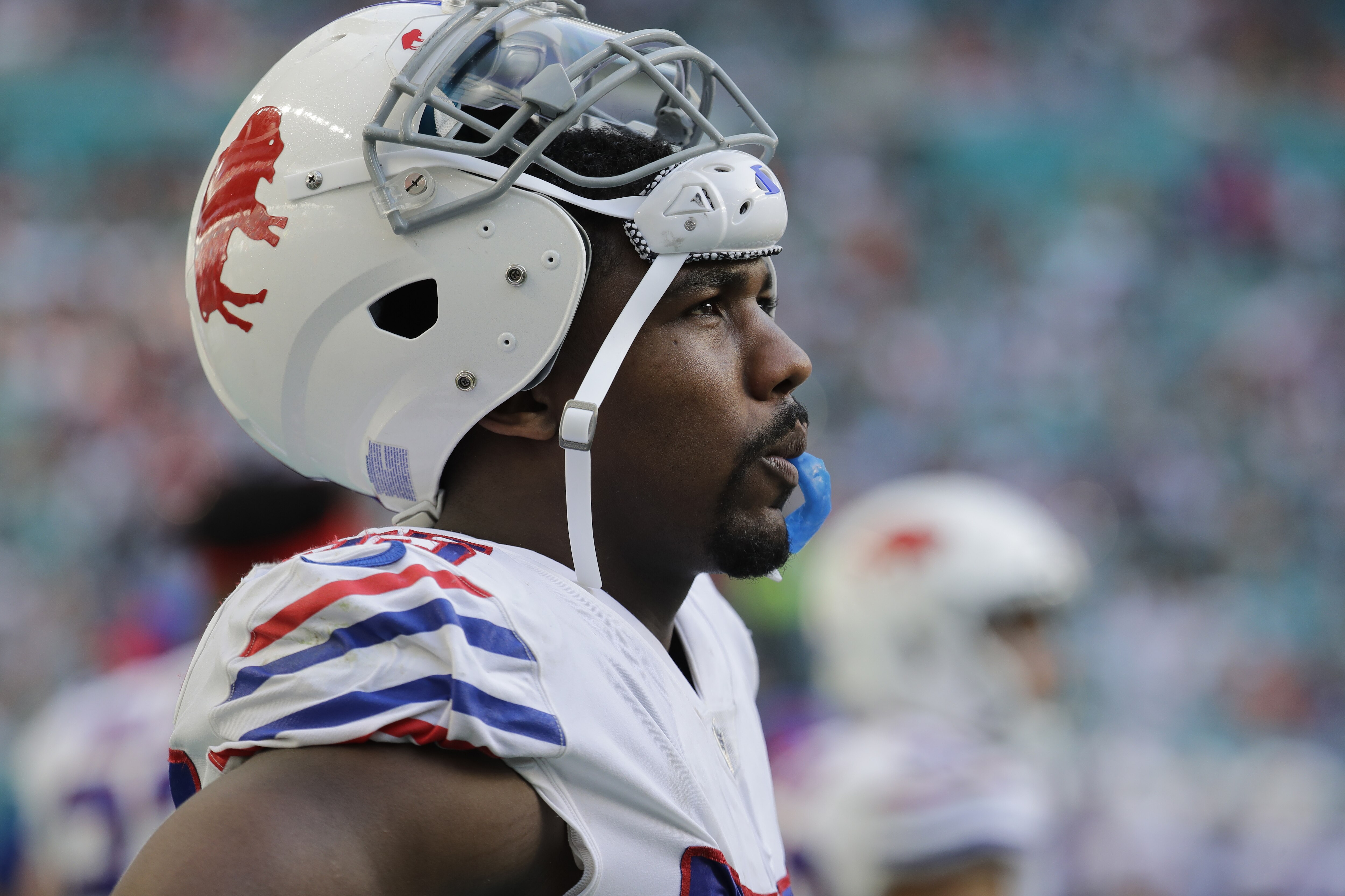 Buffalo Bills defensive end Jerry Hughes (55) watched the game from the sidelines, during the second half of an NFL football game against the Miami Dolphins, Sunday, Dec. 2, 2018, in Miami Gardens, Fla. (AP Photo/Lynne Sladky)