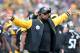 Pittsburgh Steelers head coach Mike Tomlin gestures to a referee during the first half of an NFL football game in Pittsburgh, Sunday, Dec. 21, 2014. (AP Photo/Don Wright)