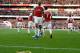 A banana thrown from the crowd is seen at the side of the pitch as Arsenal's Gabonese striker Pierre-Emerick Aubameyang (C) celebrates after scoring the opening goal from the penalty spot during the English Premier League football match between Arsenal and Tottenham Hotspur at the Emirates Stadium in London on December 2, 2018. (Photo by Ian KINGTON / IKIMAGES / AFP) / RESTRICTED TO EDITORIAL USE. No use with unauthorized audio, video, data, fixture lists, club/league logos or 'live' services. Online in-match use limited to 45 images, no video emulation. No use in betting, games or single club/league/player publications. (Photo credit should read IAN KINGTON/AFP/Getty Images)