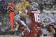 Washington State quarterback Gardner Minshew takes a snap as snow falls during the first half of an NCAA college football game against Washington, Friday, Nov. 23, 2018, in Pullman, Wash. (AP Photo/Ted S. Warren)