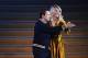 Olympique Lyonnais' Norwegian forward Ada Hegerberg (R) dances with French DJ and producer Martin Solveig after receiving the 2018 FIFA Women's Ballon d'Or award for best player of the year during the 2018 FIFA Ballon d'Or award ceremony at the Grand Palais in Paris on December 3, 2018. - The winner of the 2018 Ballon d'Or will be revealed at a glittering ceremony in Paris on December 3 evening, with Croatia's Luka Modric and a host of French World Cup winners all hoping to finally end the 10-year duopoly of Cristiano Ronaldo and Lionel Messi. (Photo by FRANCK FIFE / AFP) (Photo credit should read FRANCK FIFE/AFP/Getty Images)