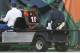 Cincinnati Bengals wide receiver A.J. Green is helped off the field after an apparent injury in the first half of an NFL football game against the Denver Broncos, Sunday, Dec. 2, 2018, in Cincinnati. (AP Photo/Gary Landers)
