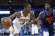Phoenix Suns forward Trevor Ariza (3) drives around Oklahoma City Thunder forward Paul George (13) in the first half of an NBA basketball game in Oklahoma City, Sunday, Oct. 28, 2018. (AP Photo/Sue Ogrocki)
