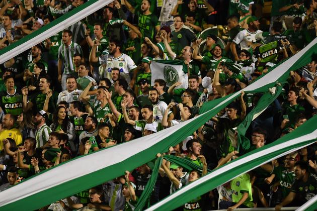 Supporters of Brazilian Chapecoense cheer for their team during their 2017 Copa Sudamericana football match against Argentina's Defensa y Justicia held at Arena Conda stadium, in Chapeco, Brazil, on July 25, 2017. / AFP PHOTO / NELSON ALMEIDA        (Photo credit should read NELSON ALMEIDA/AFP/Getty Images)