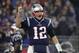 FILE - In this Sunday, Dec. 2, 2018, file photo, New England Patriots quarterback Tom Brady celebrates a touchdown during an NFL football game against the Minnesota Vikings at Gillette Stadium in Foxborough, Mass. Brady's next touchdown pass will move him past a couple of all-time greats. Brady is currently tied with Brett Favre for third place for the most regular-season TD passes with 508. Brady is also tied with Peyton Manning for the most ever combined in the regular season and playoffs with 579. (Winslow Townson/AP Images for Panini, FIle)