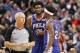TORONTO, ON - DECEMBER 05: Joel Embiid #21 of the Philadelphia 76ers is restrained by Jimmy Butler #23 after receiving a technical foul in the fourth quarter from referee Jason Phillips #23 against the Toronto Raptors at Scotiabank Arena on December 5, 2018 in Toronto, Canada. NOTE TO USER: User expressly acknowledges and agrees that, by downloading and or using this photograph, User is consenting to the terms and conditions of the Getty Images License Agreement. (Photo by Tom Szczerbowski/Getty Images)