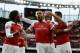 Arsenal's Gabonese striker Pierre-Emerick Aubameyang (C) celebrates after scoring the opening goal from the penalty spot during the English Premier League football match between Arsenal and Tottenham Hotspur at the Emirates Stadium in London on December 2, 2018. (Photo by Ian KINGTON / IKIMAGES / AFP) / RESTRICTED TO EDITORIAL USE. No use with unauthorized audio, video, data, fixture lists, club/league logos or 'live' services. Online in-match use limited to 45 images, no video emulation. No use in betting, games or single club/league/player publications. (Photo credit should read IAN KINGTON/AFP/Getty Images)