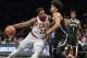 Cleveland Cavaliers center Tristan Thompson (13) pushes in on Brooklyn Nets guard Allen Crabbe (33) in the first half of an NBA basketball game, Monday, Dec. 3, 2018, in New York. (AP Photo/Howard Simmons)