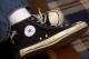 FILE - In this March 27, 2001 file photo, Mike Costantino displays his pair of Converse