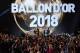 2018 Ballon d'Or awarded for best player of the year, Men's Ballon d'Or Real Madrid's Croatian midfielder Luka Modric (2ndL) is congratulated by former French footballer and host David Ginola (L) past Women's Ballon d'Or Olympique Lyonnais' Norwegian forward Ada Hegerberg (C) and Under-21 Ballon d'Or (Kopa trophy) Paris Saint-Germain's French forward Kylian Mbappe (2ndR) at the end of the 2018 Ballon d'Or award ceremony at the Grand Palais in Paris on December 3, 2018. (Photo by FRANCK FIFE / AFP) (Photo credit should read FRANCK FIFE/AFP/Getty Images)