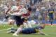 Exequiel Palacios of Argentina's River Plate, front, fights for the ball with Nahitan Nandez of Argentina's Boca Juniors, down, during the first leg soccer match of the Copa Libertadores final in Buenos Aires, Argentina, Sunday, Nov. 11, 2018. (AP Photo/Gustavo Garello)