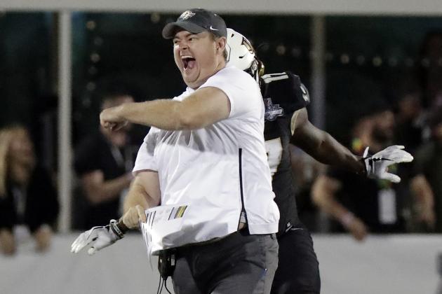Central Florida head coach Josh Heupel runs on the field and celebrates during the final seconds of the American Athletic Conference championship NCAA college football game against Memphis, Saturday, Dec. 1, 2018, in Orlando, Fla. (AP Photo/John Raoux)