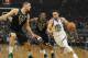Golden State Warriors' Stephen Curry drives past Milwaukee Bucks' Eric Bledsoe and Brook Lopez during the first half of an NBA basketball game Friday, Dec. 7, 2018, in Milwaukee. (AP Photo/Morry Gash)