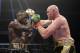 FILE - In this Dec. 1, 2018, file photo, Tyson Fury, right, of England, connects with Deontay Wilder during a WBC heavyweight championship boxing match in Los Angeles. Wilder is still frustrated by the way he fought in his draw with Fury. The WBC heavyweight champion watched a replay of the fight for the first time Thursday, Dec. 6, 2018, and saw things he did incorrectly. (AP Photo/Mark J. Terrill, File)
