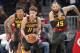 Atlanta Hawks' Trae Young (11), Kent Bazemore, and DeAndre' Bembry (95) run down court during the first half of an NBA basketball game against the Washington Wizards Wednesday, Dec. 5, 2018, in Atlanta. (AP Photo/John Bazemore)