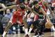 Houston Rockets' James Harden (13) tries to steal the ball from San Antonio Spurs' Patty Mills during the first half of an NBA basketball game Monday, March 12, 2018, in Houston. (AP Photo/David J. Phillip)