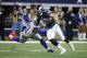 Philadelphia Eagles' Dallas Goedert (88) escapes a tackle attempt by Dallas Cowboys defensive end DeMarcus Lawrence (90) in the second half of an NFL football game in Arlington, Texas, Sunday, Dec. 9, 2018. (AP Photo/Michael Ainsworth)