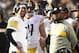 Pittsburgh Steelers quarterback Ben Roethlisberger, left, talks with head coach Mike Tomlin during the first half of an NFL football game against the Oakland Raiders in Oakland, Calif., Sunday, Dec. 9, 2018. (AP Photo/Ben Margot)