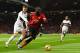 Fulham's English defender Alfie Mawson (L) vies with Manchester United's Belgian striker Romelu Lukaku during the English Premier League football match between Manchester United and Fulham at Old Trafford in Manchester, north west England, on December 8, 2018. (Photo by Paul ELLIS / AFP) / RESTRICTED TO EDITORIAL USE. No use with unauthorized audio, video, data, fixture lists, club/league logos or 'live' services. Online in-match use limited to 120 images. An additional 40 images may be used in extra time. No video emulation. Social media in-match use limited to 120 images. An additional 40 images may be used in extra time. No use in betting publications, games or single club/league/player publications. / (Photo credit should read PAUL ELLIS/AFP/Getty Images)