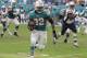 Miami Dolphins running back Kenyan Drake (32) runs for a touchdown during the second half of an NFL football game against the New England Patriots, Sunday, Dec. 9, 2018, in Miami Gardens, Fla. The Dolphins defeated the Patriots 34-33. (AP Photo/Lynne Sladky)