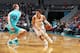CHARLOTTE, NC - NOVEMBER 28: Trae Young #11 of the Atlanta Hawks handles the ball against the Charlotte Hornets on November 28, 2018 at the Spectrum Center in Charlotte, North Carolina. NOTE TO USER: User expressly acknowledges and agrees that, by downloading and/or using this photograph, user is consenting to the terms and conditions of the Getty Images License Agreement. Mandatory Copyright Notice: Copyright 2018 NBAE (Photo by Kent Smith/NBAE via Getty Images)