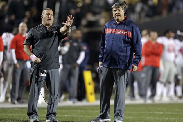 Mississippi head coach Matt Luke, right, and offensive coordinator Phil Longo, left, direct players in the first half of an NCAA college football game between Mississippi and Vanderbilt Saturday, Nov. 17, 2018, in Nashville, Tenn. (AP Photo/Mark Humphrey)