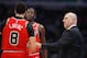 CHICAGO, ILLINOIS - DECEMBER 07: Head coach Jim Boylen of the Chicago Bulls gives instructions to Zach LaVine #8 and Justin Holiday #7 during a game against the Oklahoma City Thunder at the United Center on December 07, 2018 in Chicago, Illinois. The Bulls defeated the Thunder 114-112. NOTE TO USER: User expressly acknowledges and agrees that, by downloading and or using this photograph, User is consenting to the terms and conditions of the Getty Images License Agreement. (Photo by Jonathan Daniel/Getty Images)