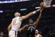 Toronto Raptors' Kyle Lowry (7) drives past Los Angeles Clippers' Marcin Gortat (13) during the first half of an NBA basketball game, Tuesday, Dec. 11, 2018, in Los Angeles. (AP Photo/Marcio Jose Sanchez)