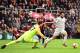 Liverpool's Egyptian midfielder Mohamed Salah (R) takes the ball around Bournemouth's Bosnian-Herzegovinian goalkeeper Asmir Begovic (L) in the build-up to scoring his third goal, Liverpool's fourth during the English Premier League football match between Bournemouth and Liverpool at the Vitality Stadium in Bournemouth, southern England on December 8, 2018. (Photo by Glyn KIRK / AFP) / RESTRICTED TO EDITORIAL USE. No use with unauthorized audio, video, data, fixture lists, club/league logos or 'live' services. Online in-match use limited to 120 images. An additional 40 images may be used in extra time. No video emulation. Social media in-match use limited to 120 images. An additional 40 images may be used in extra time. No use in betting publications, games or single club/league/player publications. / (Photo credit should read GLYN KIRK/AFP/Getty Images)