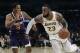 Los Angeles Lakers' LeBron James (23) dribbles next to Phoenix Suns' Trevor Ariza (3) during the second half of an NBA basketball game Sunday, Dec. 2, 2018, in Los Angeles. (AP Photo/Marcio Jose Sanchez)