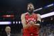 OAKLAND, CA - DECEMBER 12: Jonas Valanciunas #17 of the Toronto Raptors grimaces in pain after hurting his finger against the Golden State Warriors at ORACLE Arena on December 12, 2018 in Oakland, California. NOTE TO USER: User expressly acknowledges and agrees that, by downloading and or using this photograph, User is consenting to the terms and conditions of the Getty Images License Agreement. (Photo by Ezra Shaw/Getty Images)