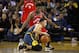 OAKLAND, CA - DECEMBER 12: Stephen Curry #30 of the Golden State Warriors dribbles on his knees while being guarded by Kyle Lowry #7 of the Toronto Raptors at ORACLE Arena on December 12, 2018 in Oakland, California. NOTE TO USER: User expressly acknowledges and agrees that, by downloading and or using this photograph, User is consenting to the terms and conditions of the Getty Images License Agreement. (Photo by Ezra Shaw/Getty Images)