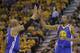Golden State Warriors' David West (3) high fives teammate Kevin Durant (35) after he scores against the Utah Jazz in the second half during Game 4 of the NBA basketball second-round playoff series Monday, May 8, 2017, in Salt Lake City. The Warriors completed a second-round sweep of the Utah Jazz with a 121-95 victory. (AP Photo/Rick Bowmer)